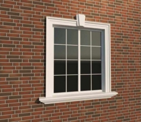 Вариант оформления окна фасадной лепниной